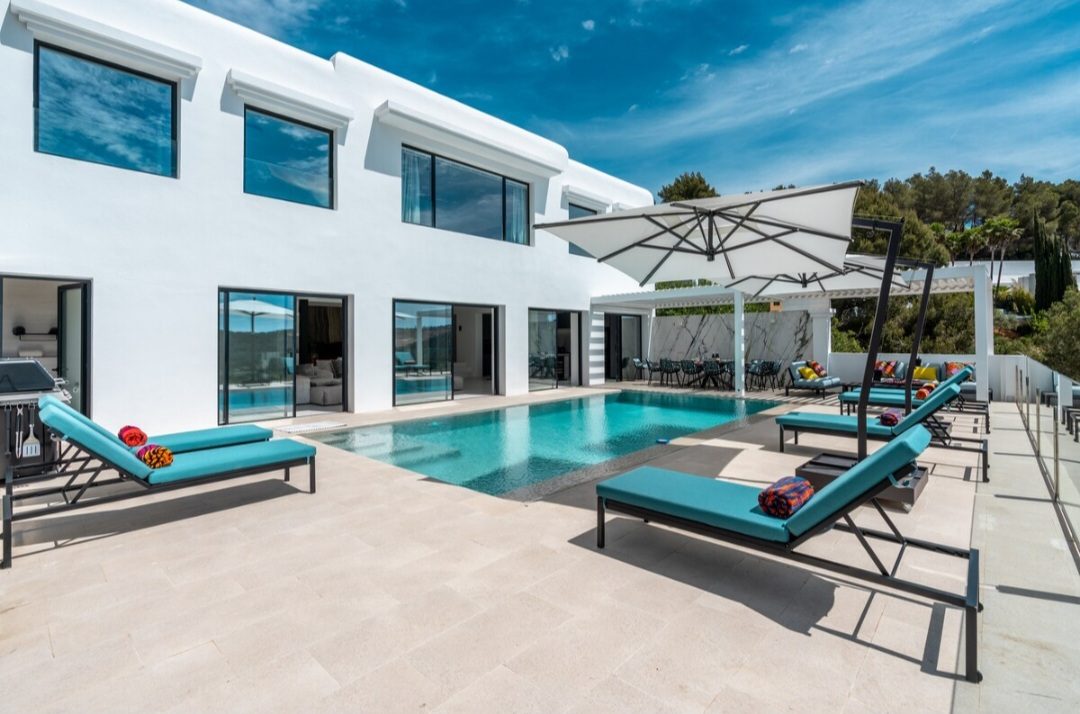 Exterior of the villa with private pool in daylight