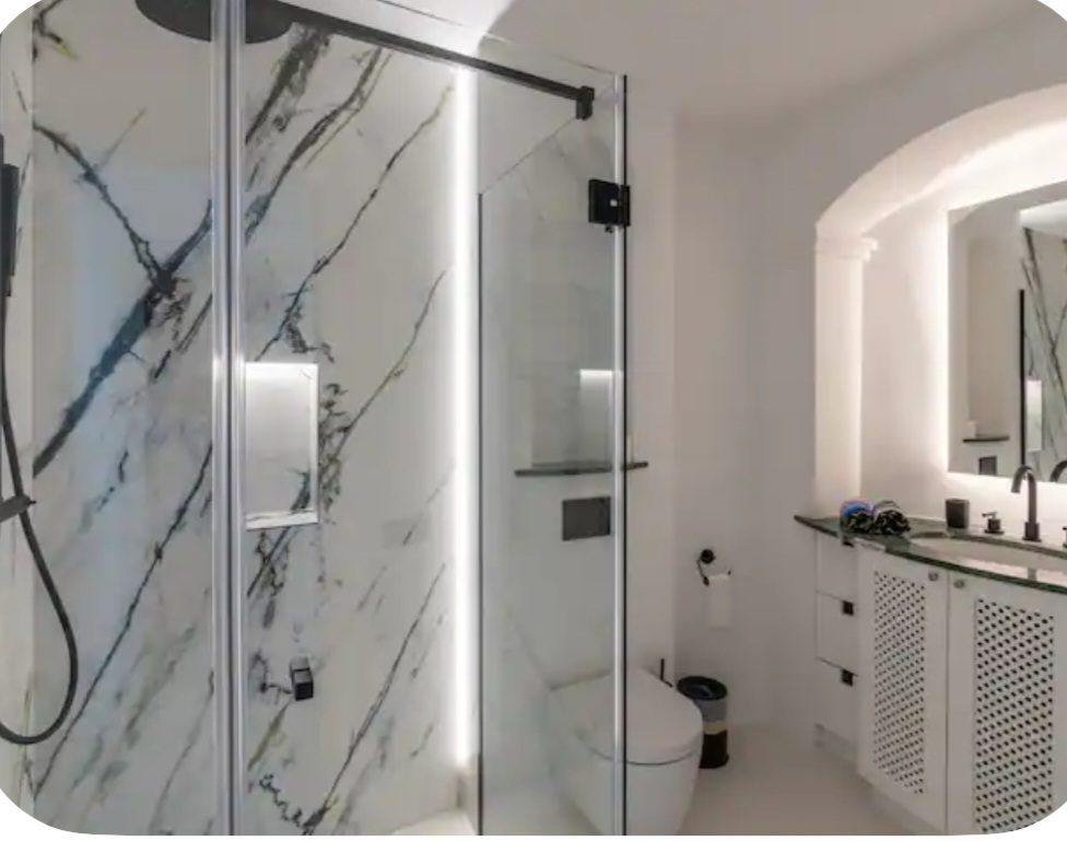 Marble en-suite bathroom with glass shower